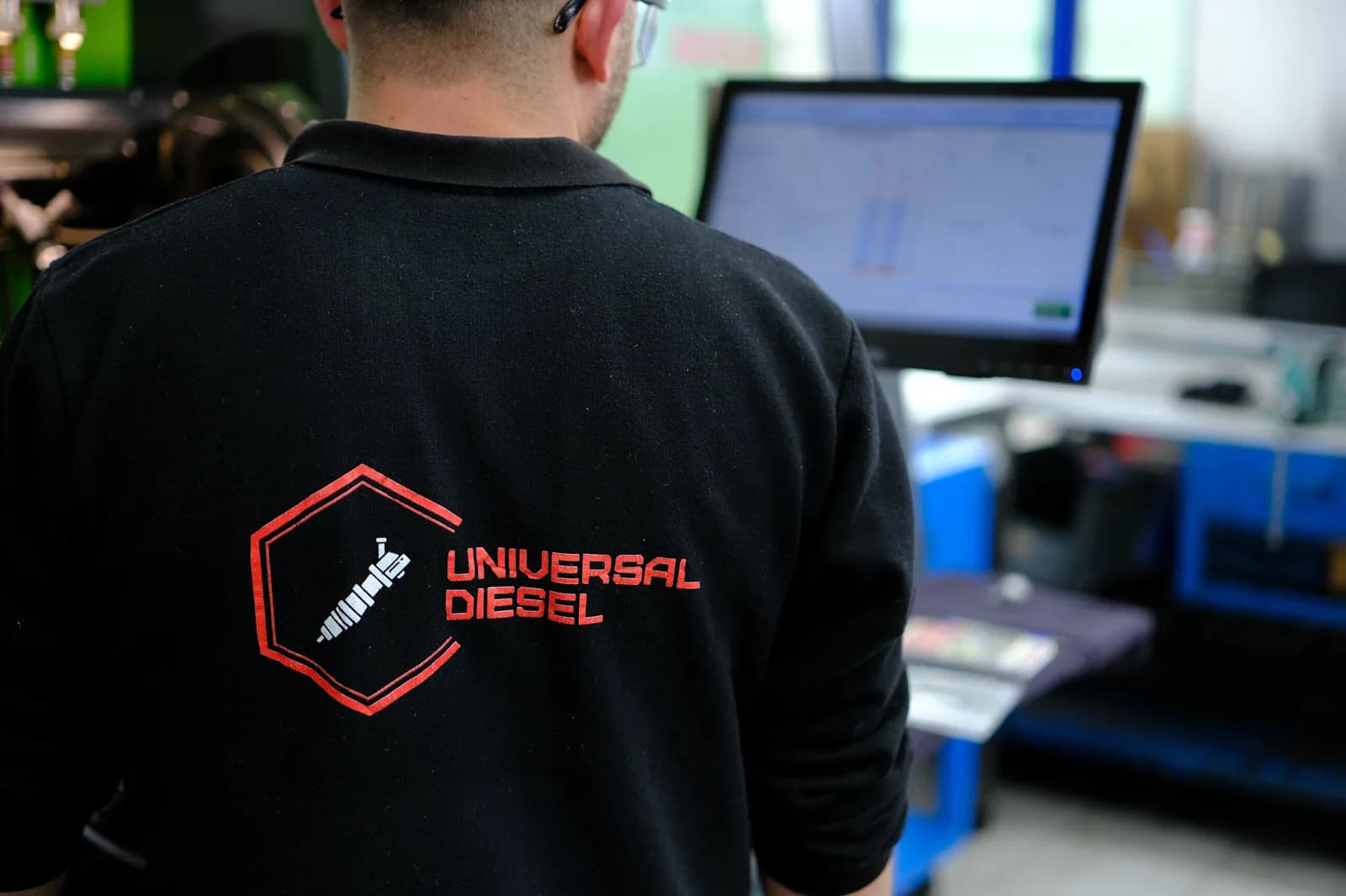 Universal Diesel technician monitoring injector test data